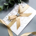 Exclusive Ivory  Laser Cut Wedding Invitation with blush pink paper and  Crystal Button Ribbon Bow WS002