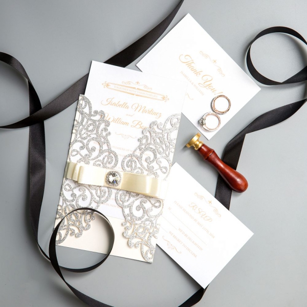 /1067119-2550-thickbox/graceful-silver-laser-wrap-wedding-invitations-with-glittery-crystal-ribbon-ws020.jpg