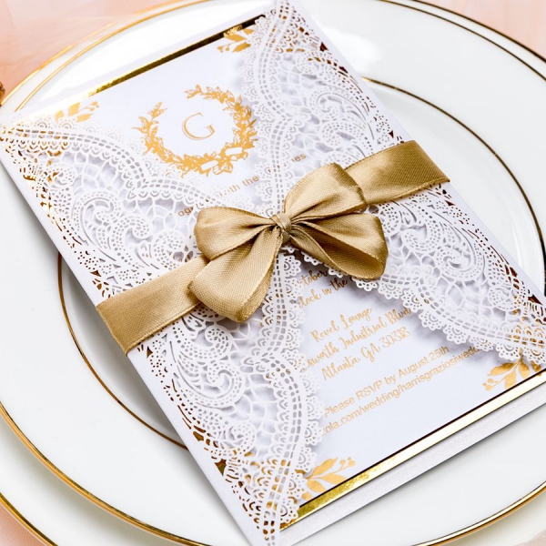 /1067227-2976-thickbox/ivory-white-laser-cut-wedding-invitations-with-gold-ribbon-ws051.jpg
